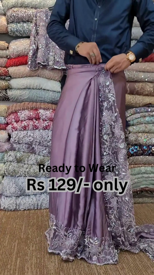 ZZZElegant Purple Net Saree with Intricate Design