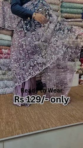 ZZZElegant Purple Net Saree with Intricate Design