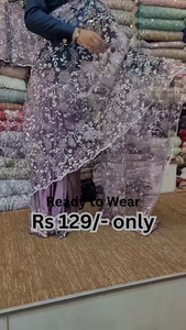 ZZZElegant Purple Net Saree with Intricate Design