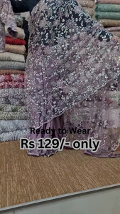 ZZZElegant Purple Net Saree with Intricate Design