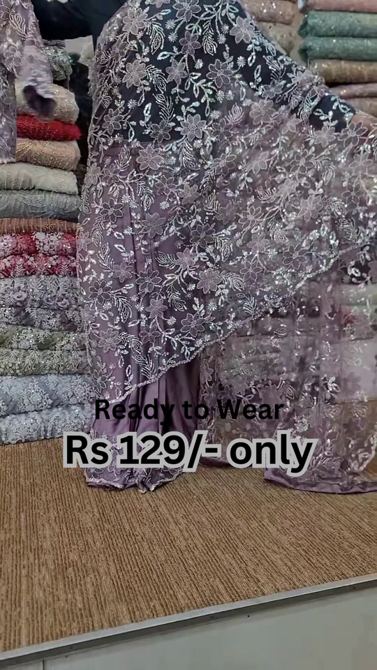 ZZZElegant Purple Net Saree with Intricate Design