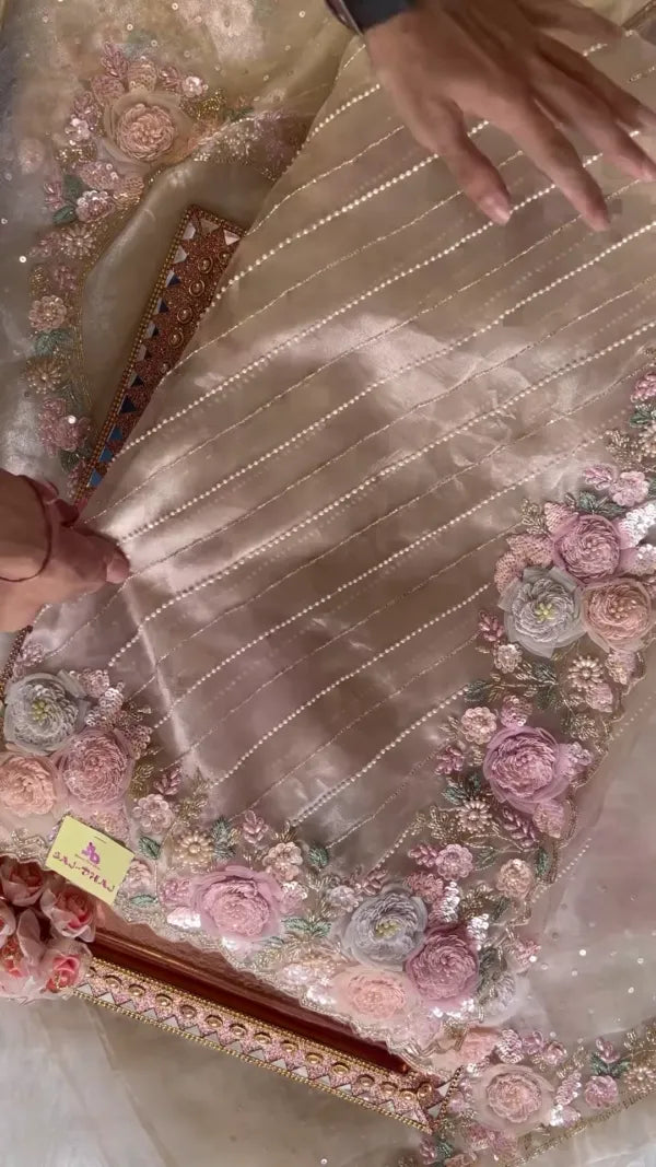 Elegant Embroidered Saree with Floral Motifs and Pearl Accents